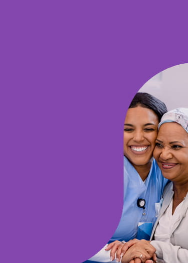 Nurse hugging cancer patient