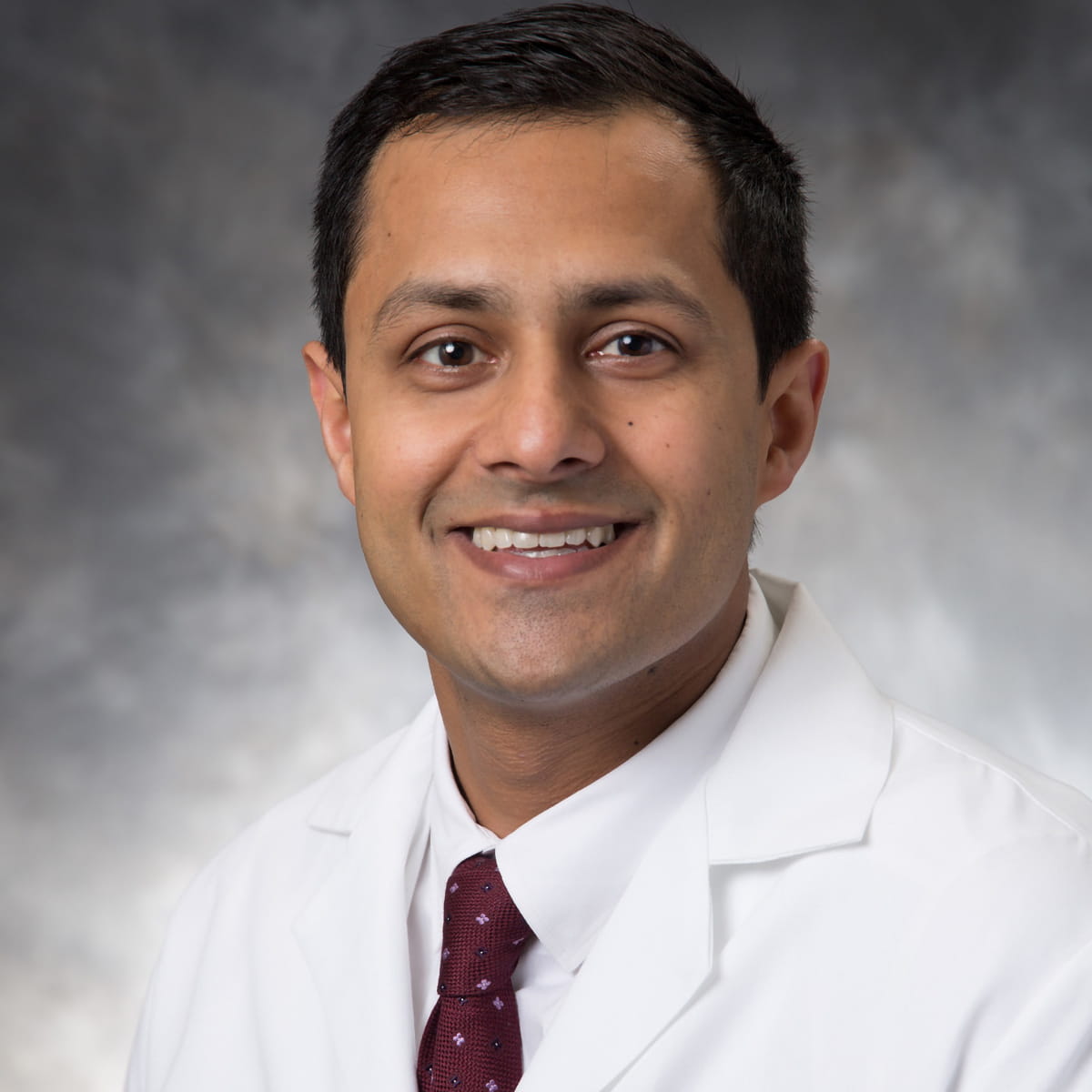 A friendly headshot of Anand Kenia, MD