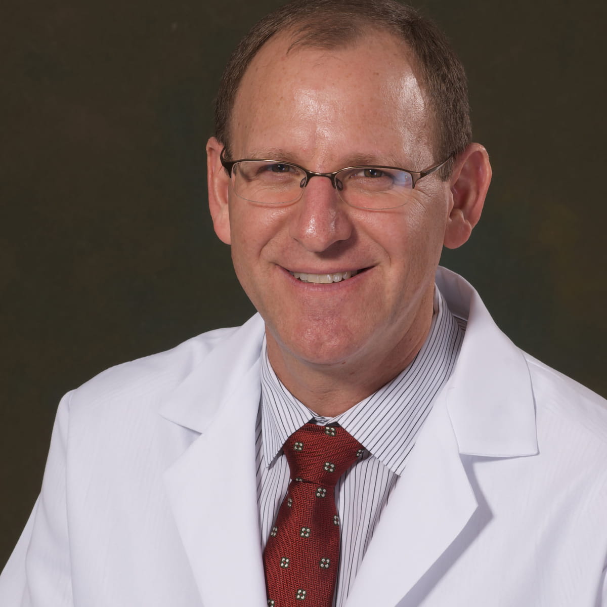 A friendly headshot of Barry Mangel, MD