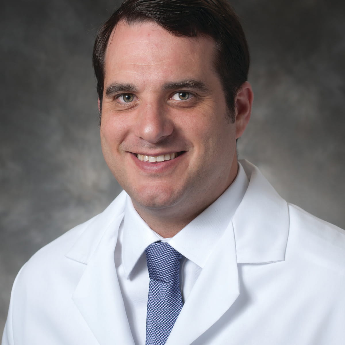 A friendly headshot of Daniel Holtz, MD