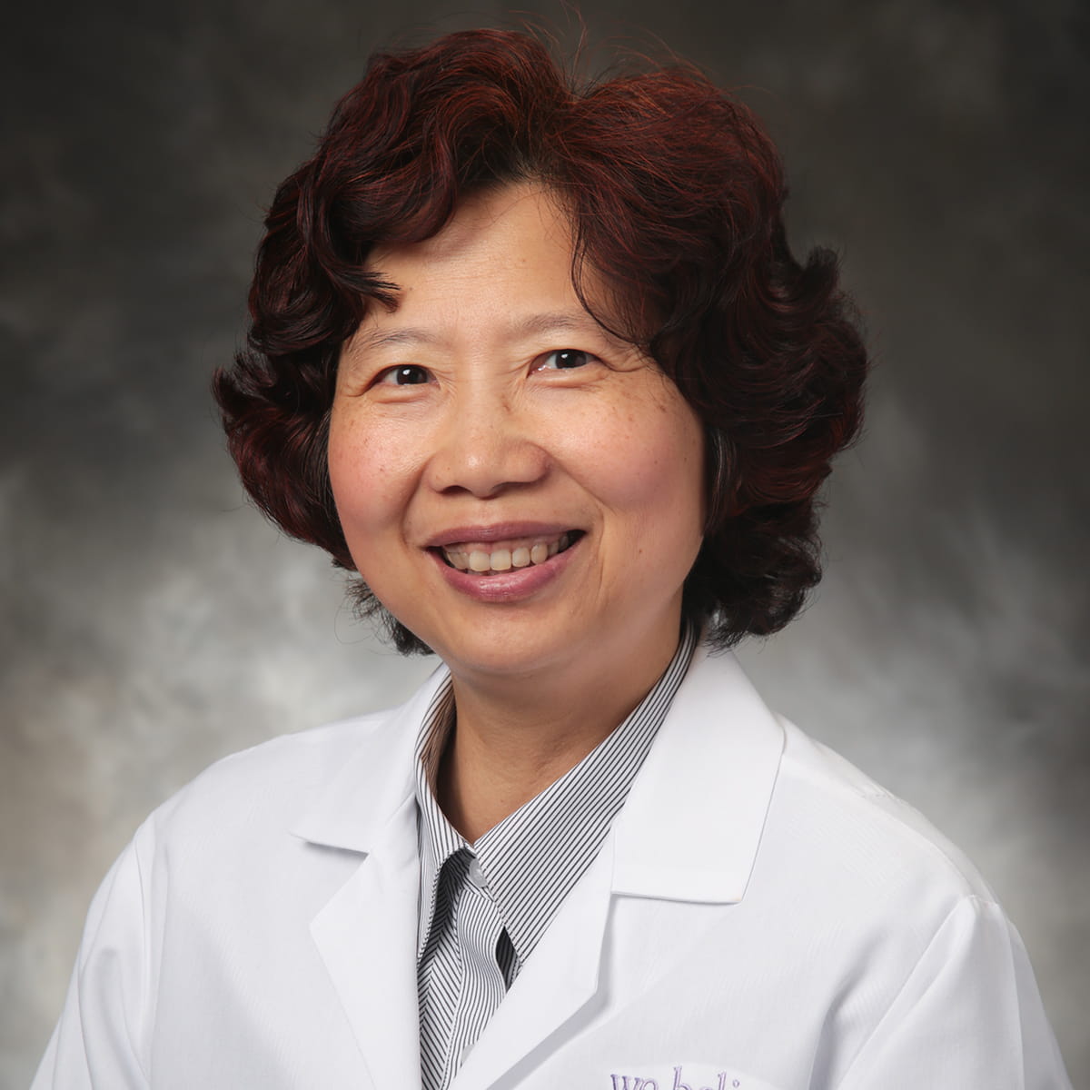 A friendly headshot of Hua Zhong, MD