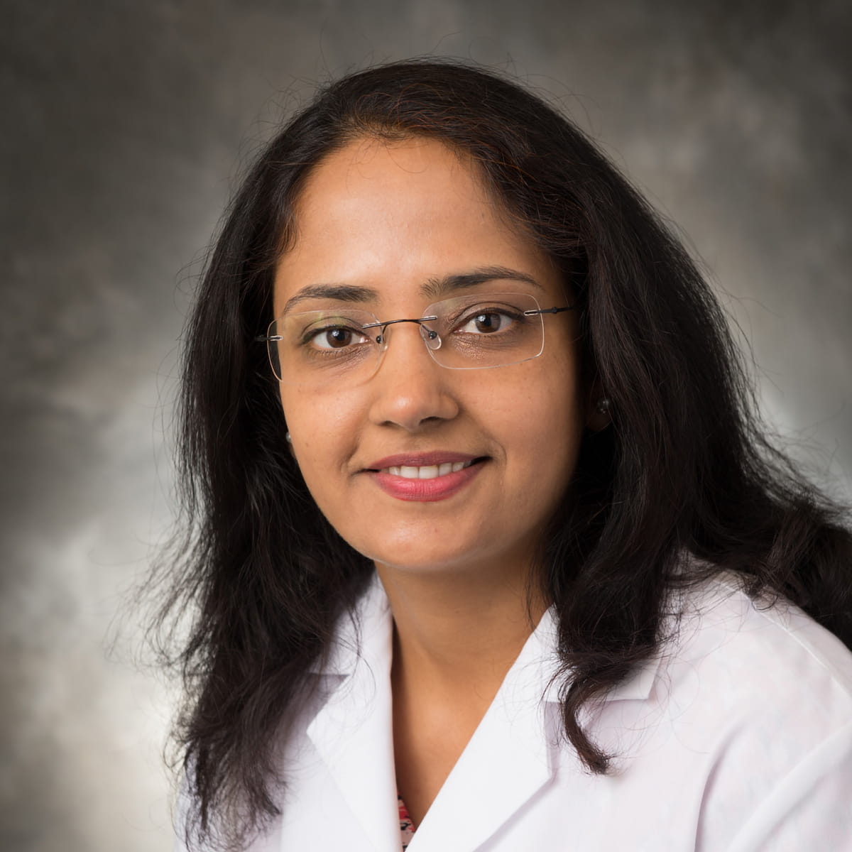 A friendly headshot of Madhavi Siddhanthi, MD