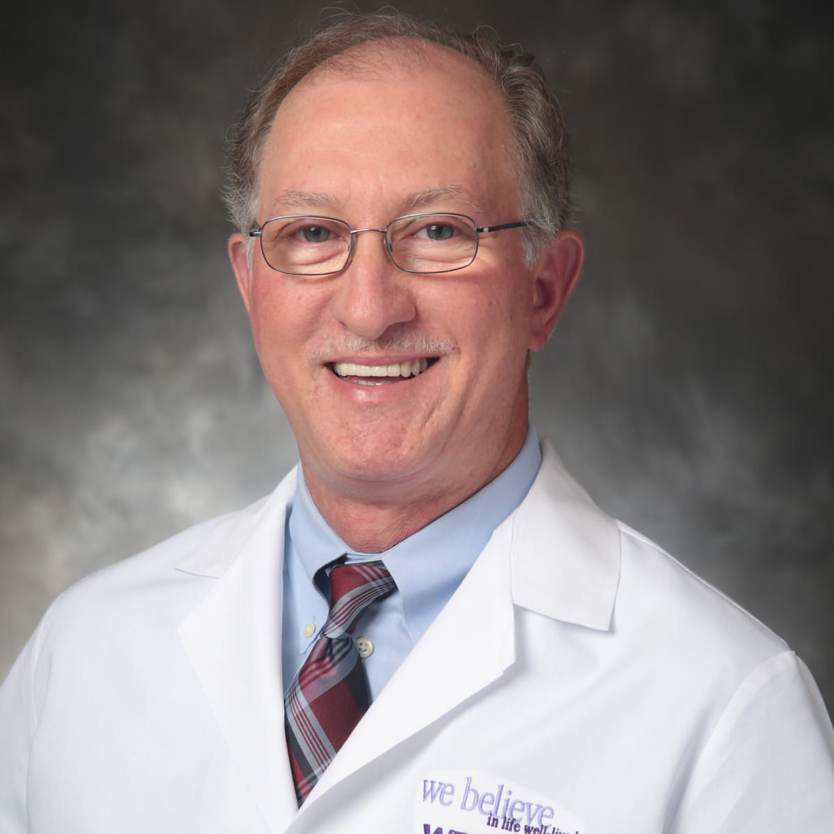 A friendly headshot of Mark Gravlee, MD