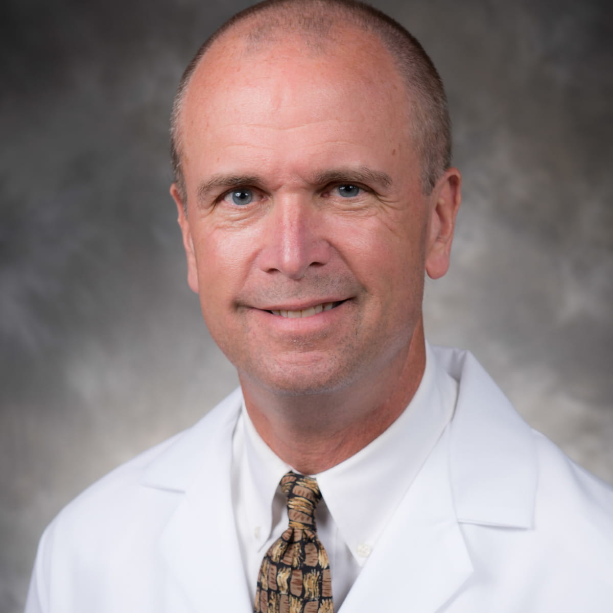 A friendly headshot of Robert Holcomb, MD