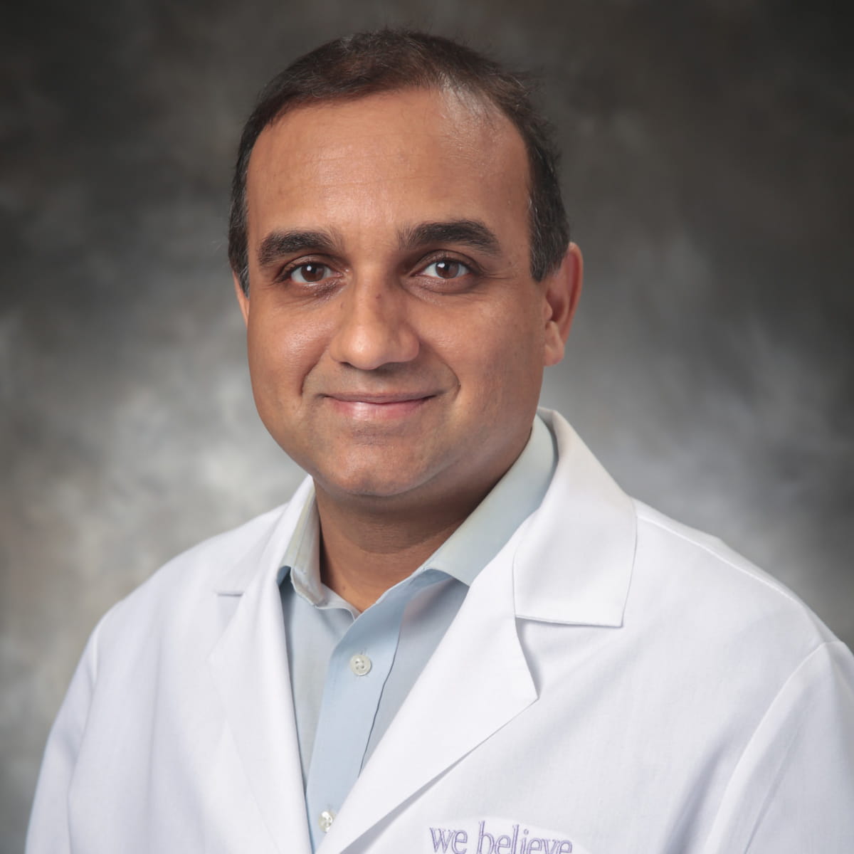 A friendly headshot of Sachin Lavania, MD