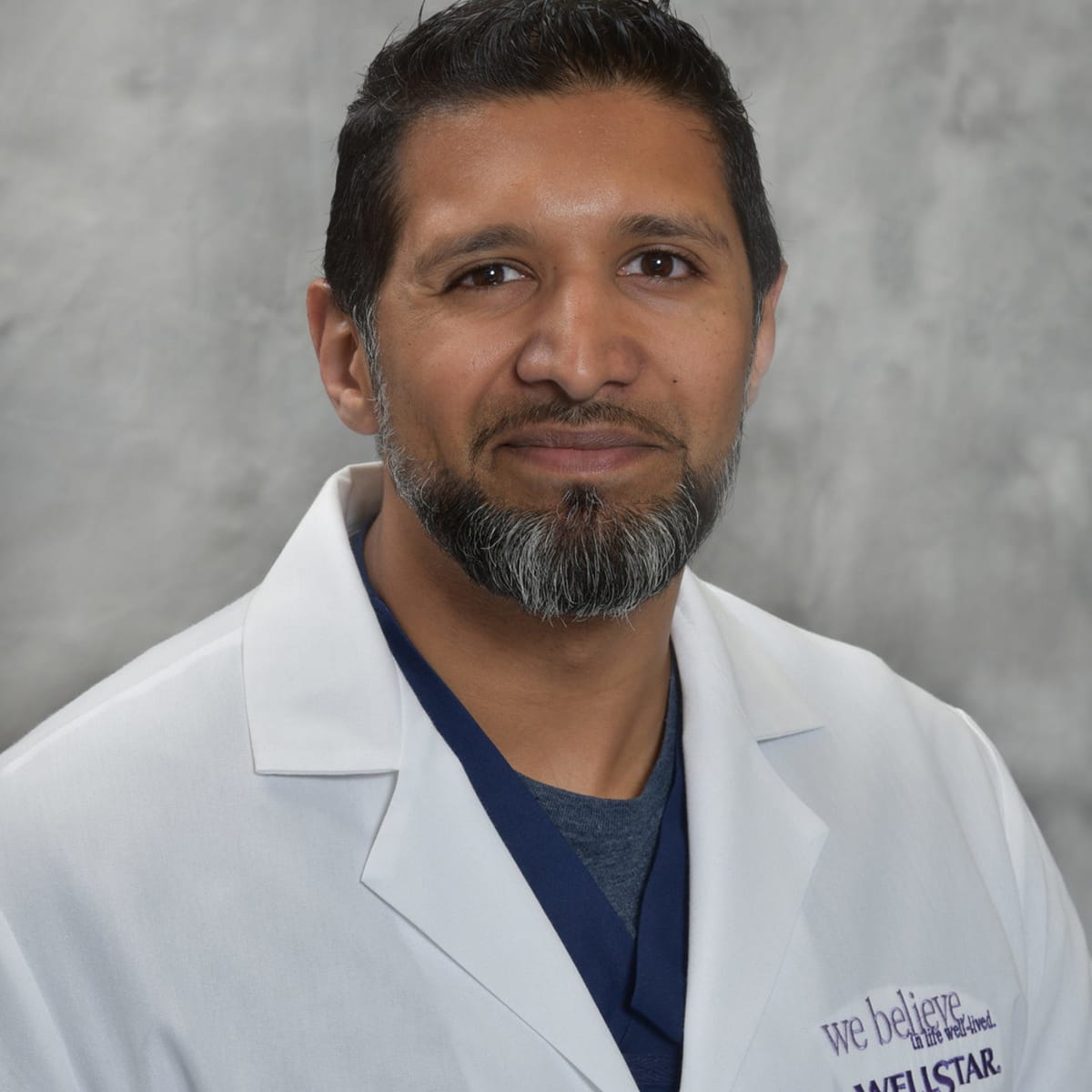 A friendly headshot of Salman Fidahussein, MD