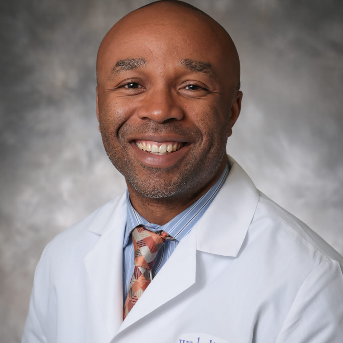 A friendly headshot of Timothy Udoji, MD