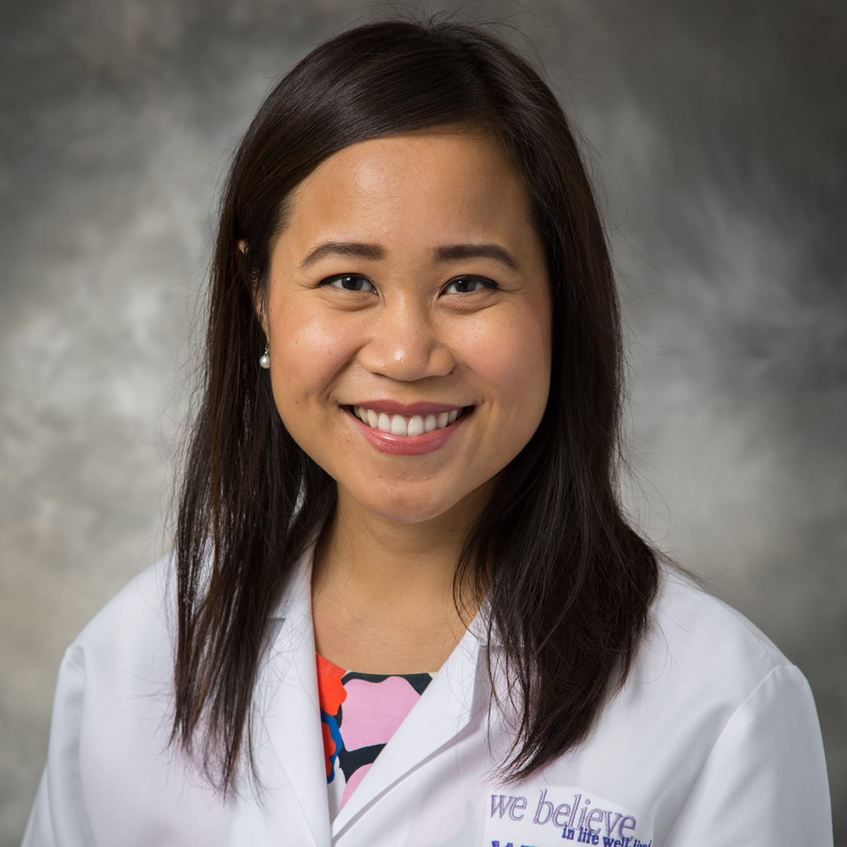 A friendly headshot of Tina Vothang, MD