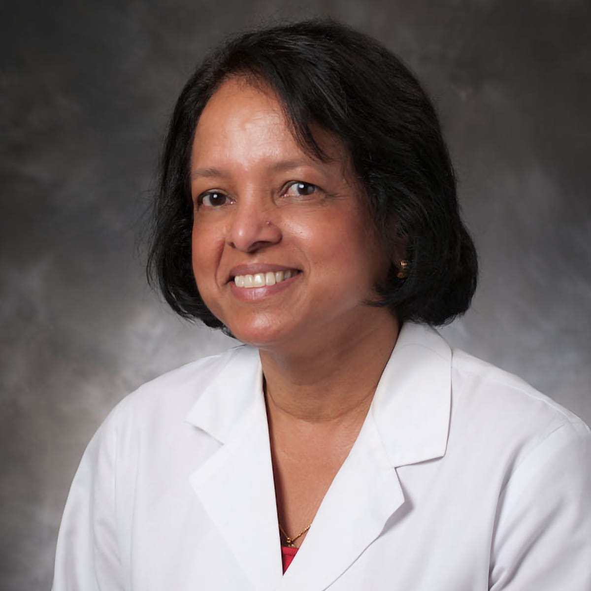 A friendly headshot of Vimala Nair, MD